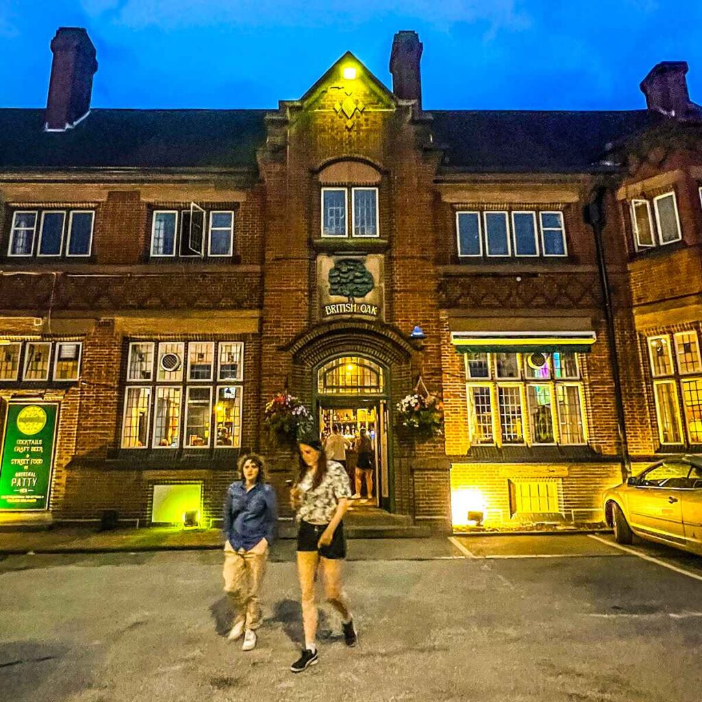 The front entrance of the British Oat pub, Birmingham with two people walking away