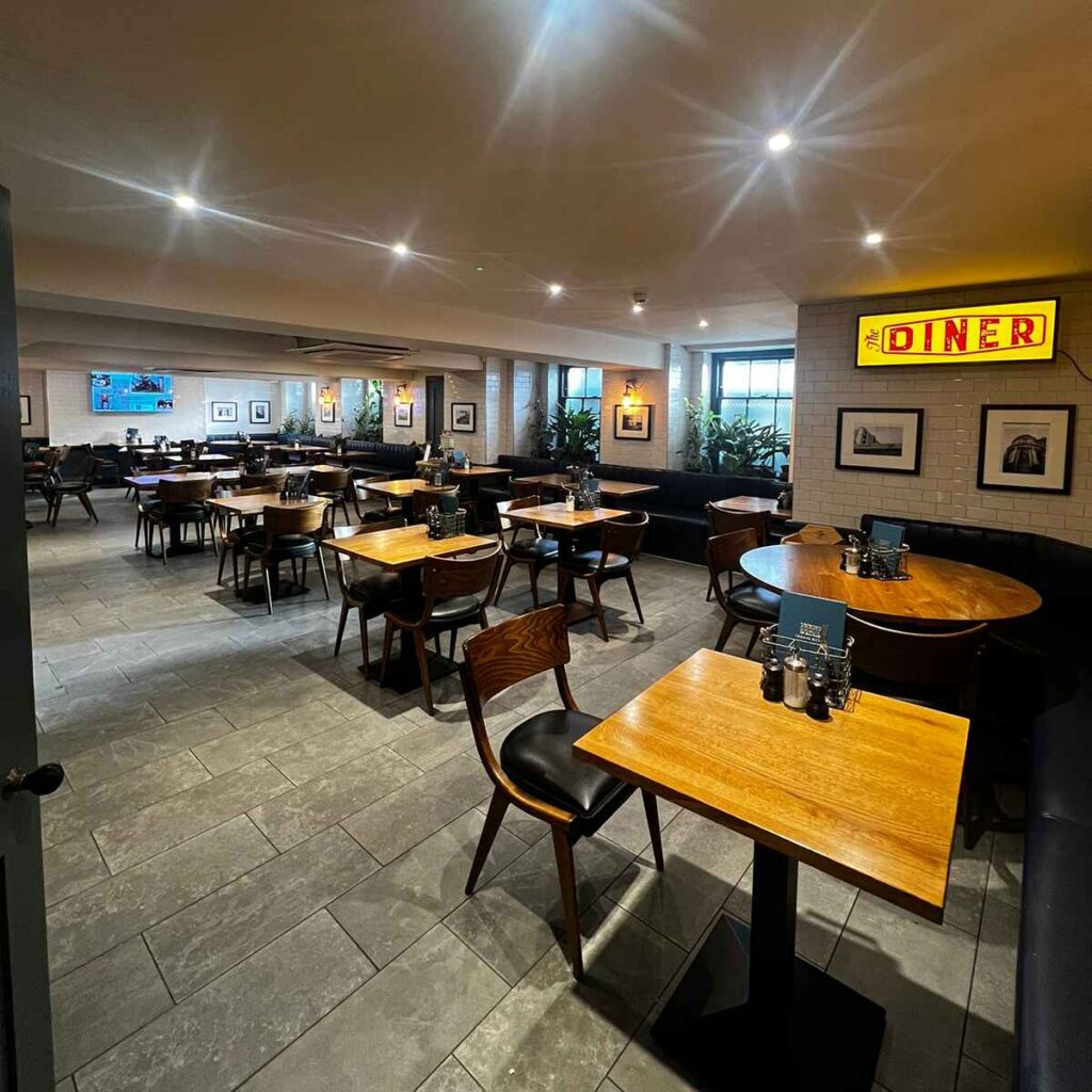 An empty dining room at the Diner restaurant at The George Hotel, Cheltenham