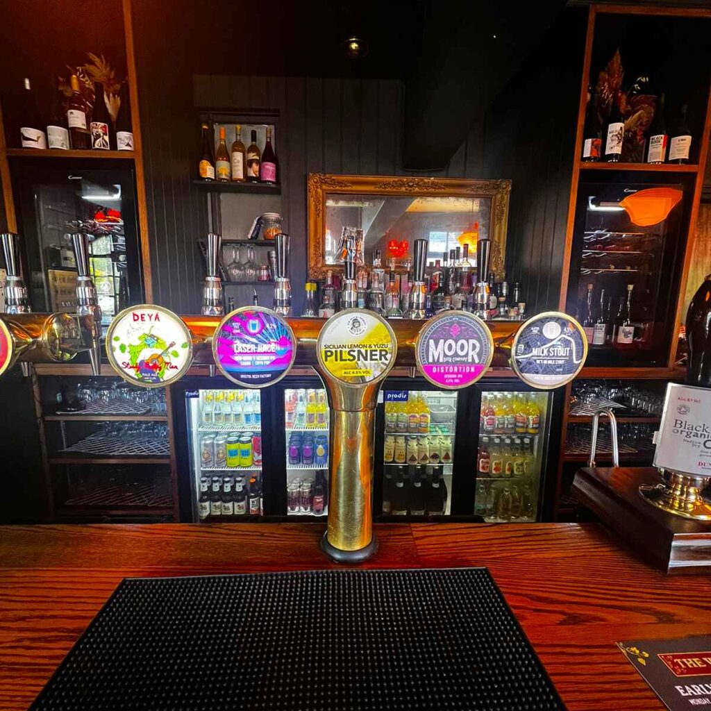 The bar at the Vine Pub in Cheltenham. Draft ale and bottles and cans of craft beer.