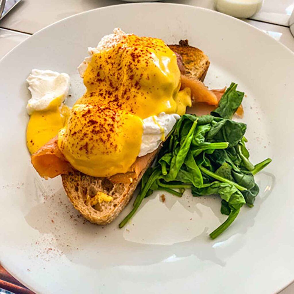 Hollandaise smothered poached eggs, smoked salmon and toast