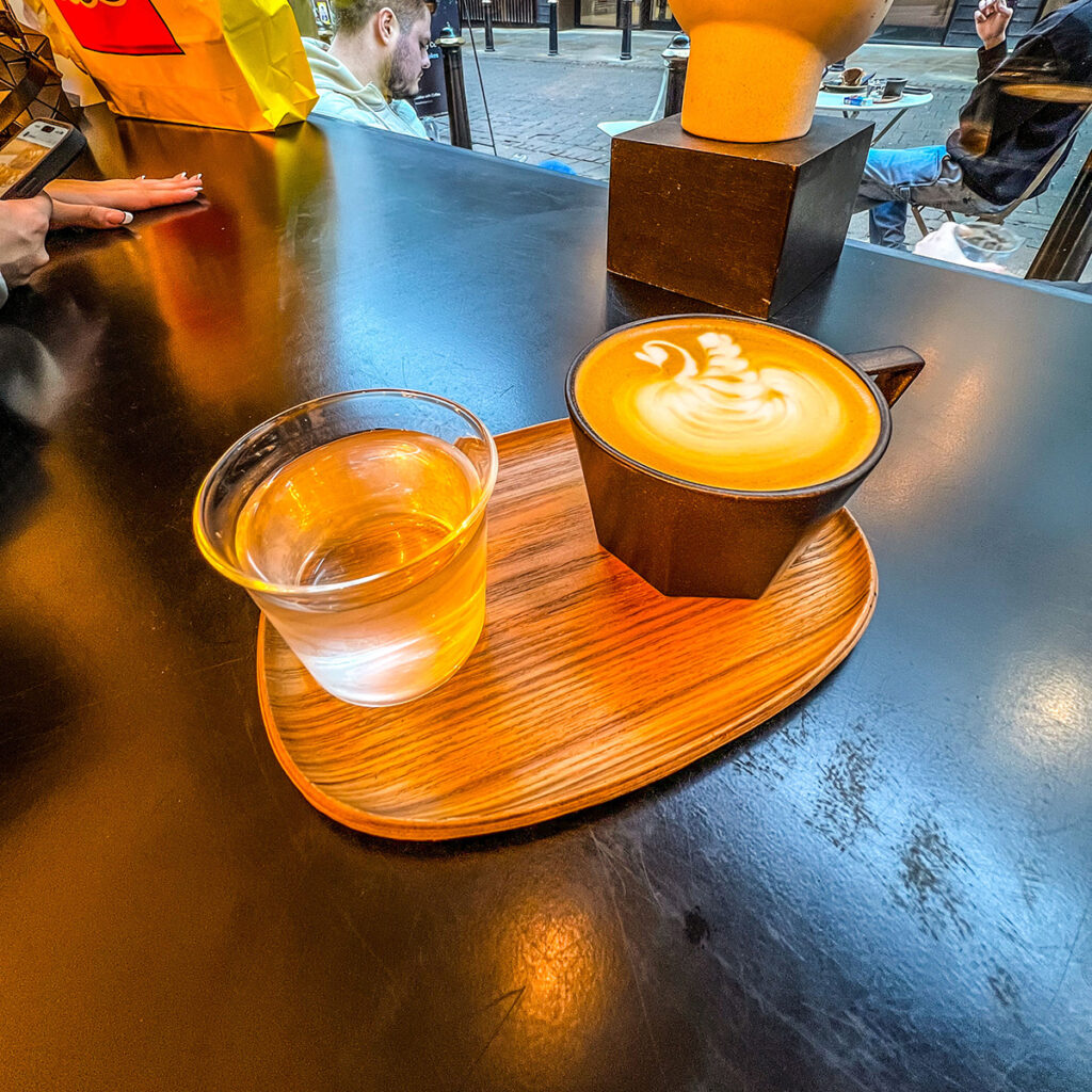 A latte and water at The Coffee Bar