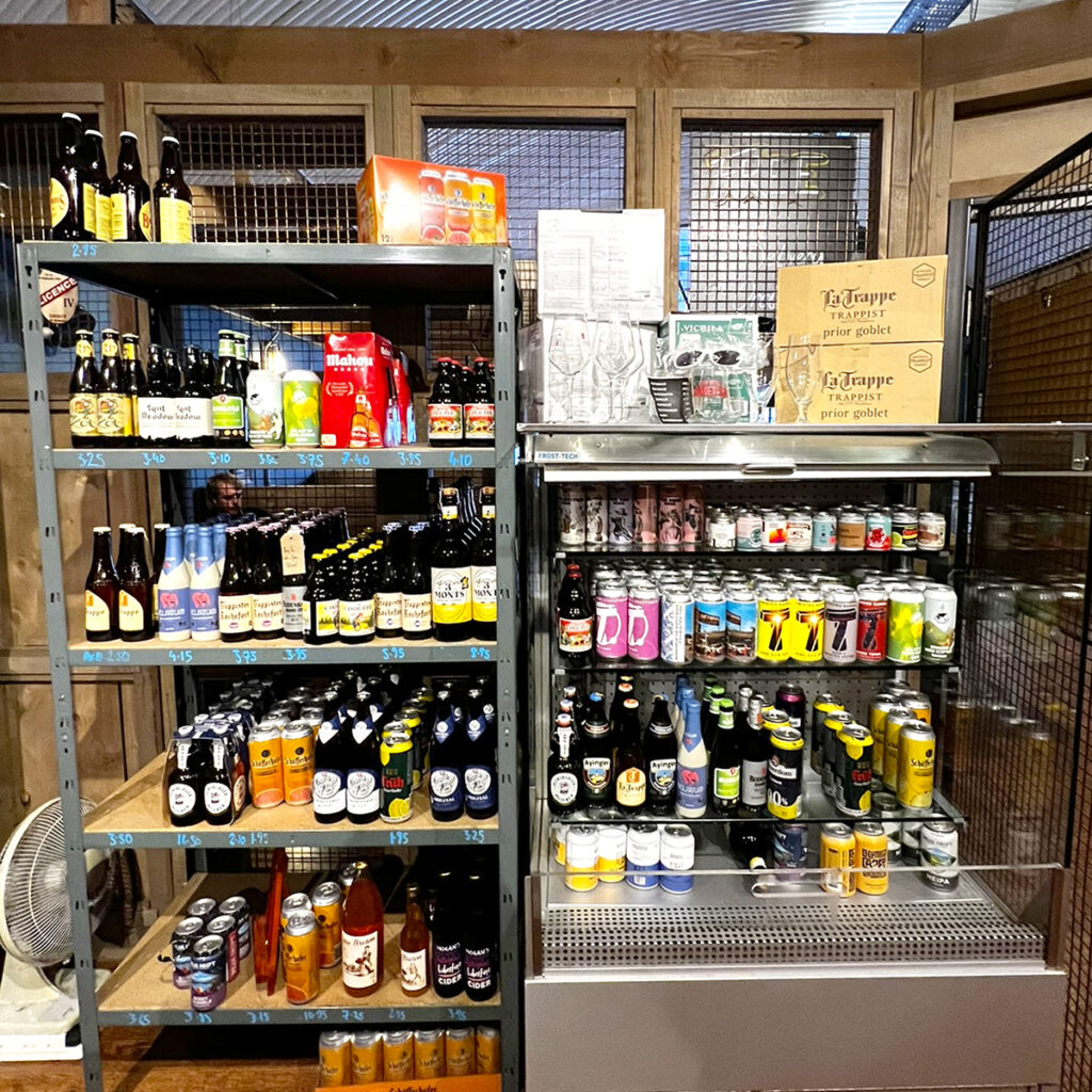 A picture of the bottle and can selection available to drink in Arch 13.