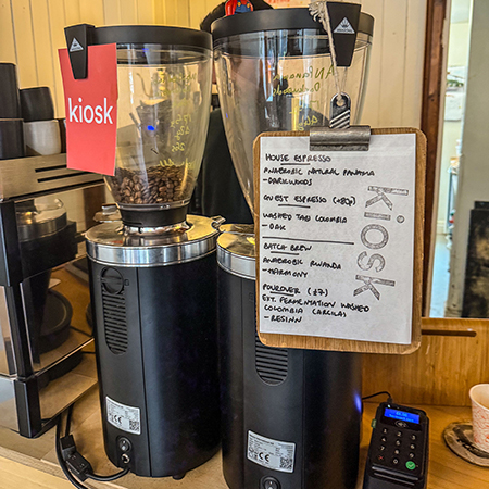 Coffee grinder and a list of house and guest roasts.